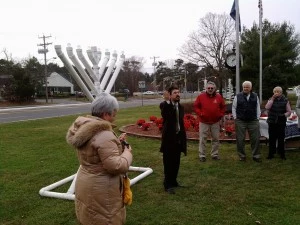 Rabbi Moesha Gourarie addresses the crowd at the lighting of the Ocean County Menorah in Manchester Township Rabbi Moesha Gourarie addresses the crowd at the lighting of the Ocean County Menorah in Manchester Township