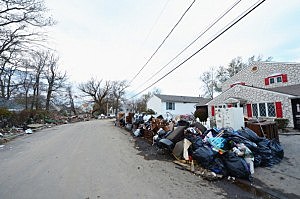 Flood-damaged belongings sit on the side of the road in a Union Beach neighborhood devastated by Superstorm Sandy Flood-damaged belongings sit on the side of the road in a Union Beach neighborhood devastated by Superstorm Sandy