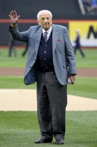 Ralph Kiner throws waves to the fans prior to throwing out the ceremonial first pitch to first base coach Mookie Wilson #1 of the New York Mets prior to the Mets playing against the Washington Nationals during the Mets' Home Opener at Citi Field on April 8, 2011 Ralph Kiner throws waves to the fans prior to throwing out the ceremonial first pitch to first base coach Mookie Wilson #1 of the New York Mets prior to the Mets playing against the Washington Nationals during the Mets' Home Opener at Citi Field on April 8, 2011
