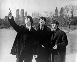 John Lennon (1940 - 1980), Paul McCartney and Ringo Starr, from left to right, enjoy a few moments away from the screaming fans when police smuggled them out of the side door of their hotel for a visit to New York's Central Park. John Lennon (1940 - 1980), Paul McCartney and Ringo Starr, from left to right, enjoy a few moments away from the screaming fans when police smuggled them out of the side door of their hotel for a visit to New York's Central Park.